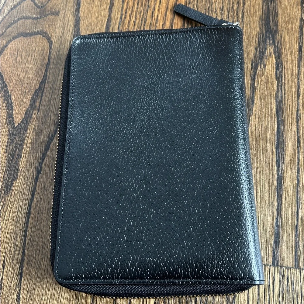Black leather Kate Spade Wellesley zip around personal organizer/planner